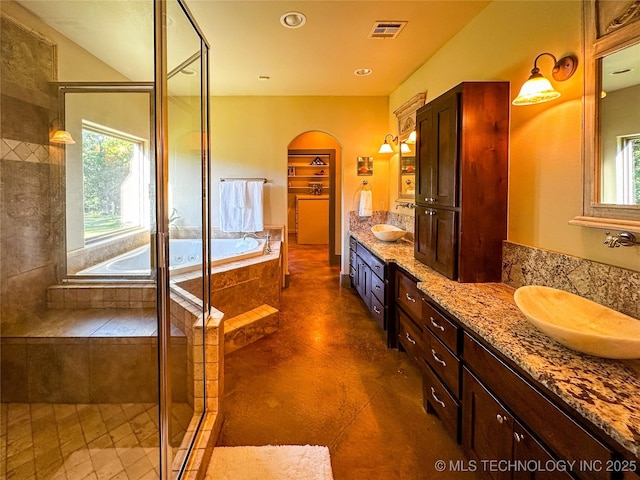 16012 N 145th Ave, Collinsville, OK 74021 - full bath with double vanity, a garden tub, a shower stall, and recessed lighting