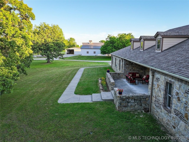 16012 N 145th Ave, Collinsville, OK 74021 - view of green lawn featuring a patio