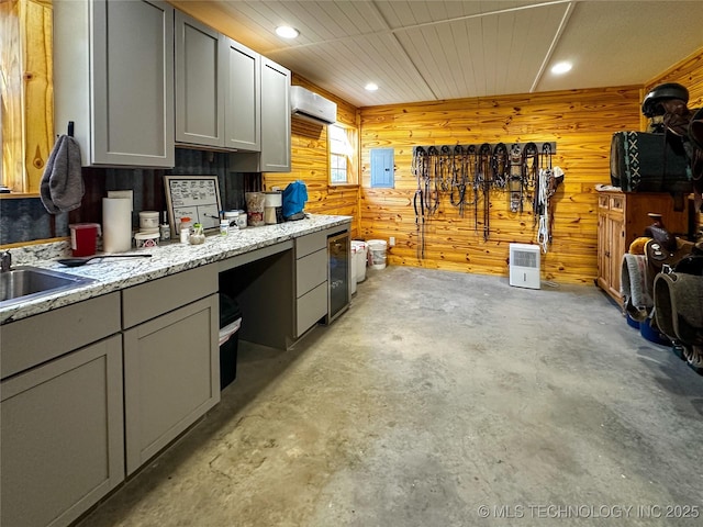 16012 N 145th Ave, Collinsville, OK 74021 - kitchen featuring concrete floors, gray cabinetry, wooden walls, recessed lighting, and a sink