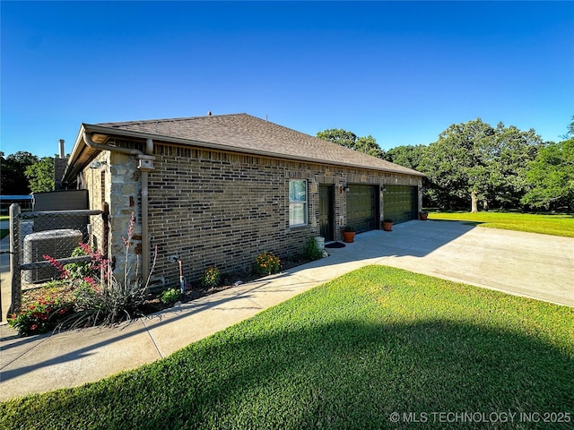 16012 N 145th Ave, Collinsville, OK 74021 - view of front facade with concrete driveway, a front lawn, roof with shingles, and brick siding