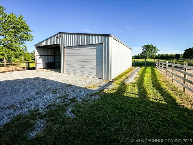 16012 N 145th Ave, Collinsville, OK 74021 - garage with a detached garage and gravel driveway