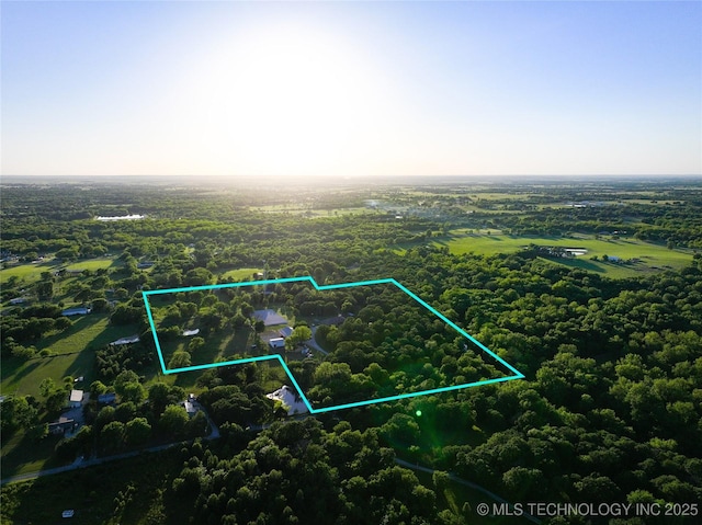 16012 N 145th Ave, Collinsville, OK 74021 - aerial view of property and surrounding area featuring property boundaries highlighted and a heavily wooded area