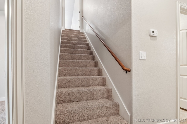3200 Heritage Dr, Claremore, OK 74019 - staircase featuring a textured wall