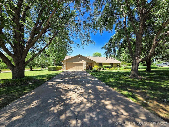20941 E 102nd St S, Broken Arrow, OK 74014 - view of front of house with a garage, a front yard, and concrete driveway