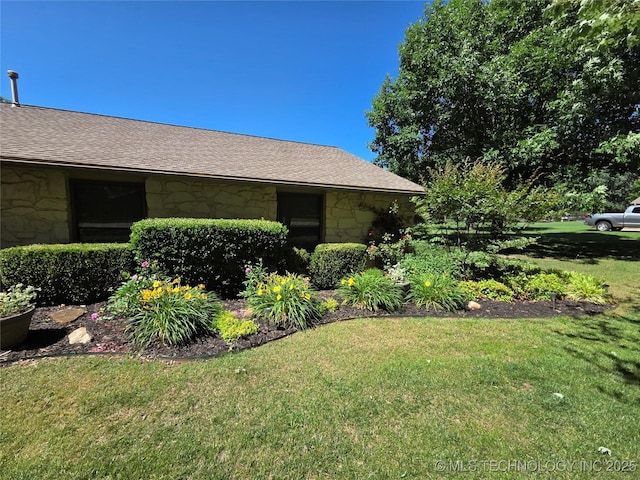 20941 E 102nd St S, Broken Arrow, OK 74014 - view of home's exterior featuring stone siding and a yard