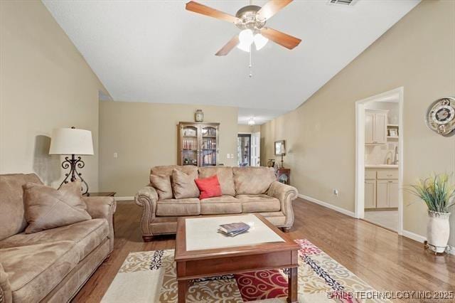 20941 E 102nd St S, Broken Arrow, OK 74014 - living area with wood finished floors, a ceiling fan, baseboards, and high vaulted ceiling