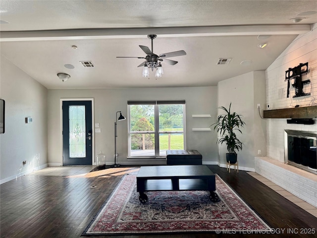 74232 S 320th Rd, Wagoner, OK 74467 - living room featuring hardwood / wood-style flooring, a ceiling fan, a fireplace, and baseboards