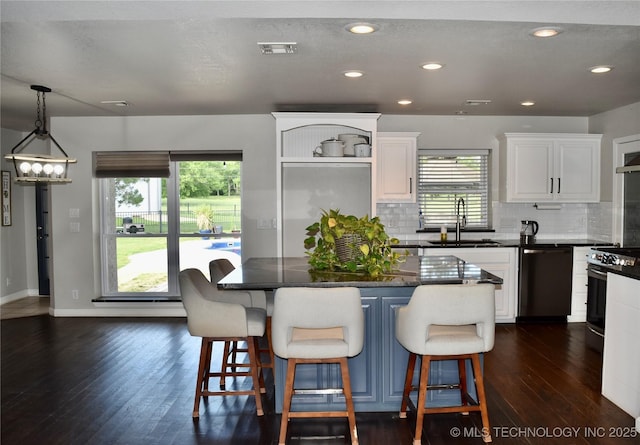74232 S 320th Rd, Wagoner, OK 74467 - kitchen featuring a sink, dishwashing machine, stove, white cabinets, and dark wood-style floors