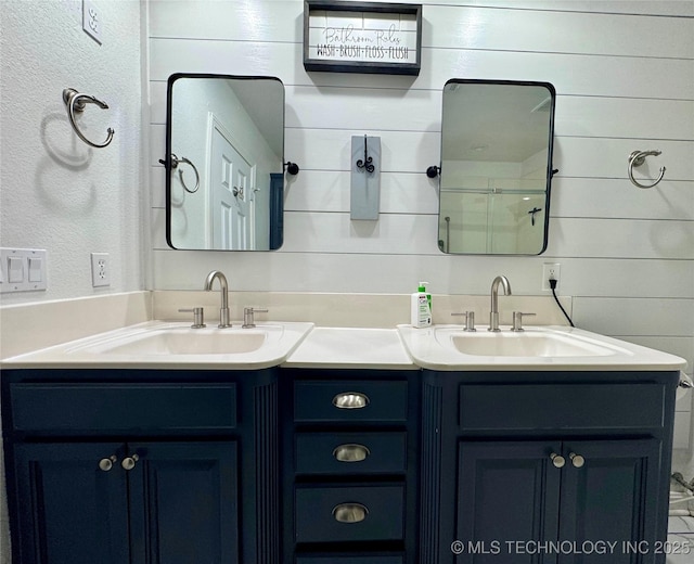 74232 S 320th Rd, Wagoner, OK 74467 - bathroom featuring double vanity and wood walls