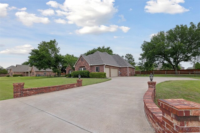 7083 E 85th St N, Owasso, OK 74055 - view of front facade featuring an attached garage, concrete driveway, and brick siding