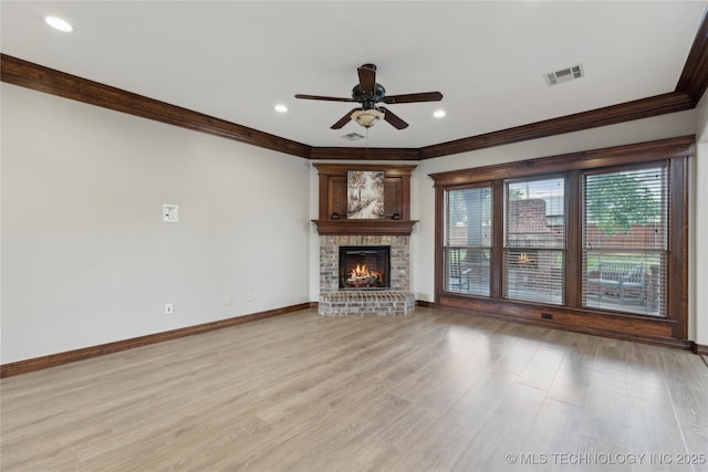 7083 E 85th St N, Owasso, OK 74055 - unfurnished living room with crown molding, ceiling fan, light wood finished floors, baseboards, and a fireplace