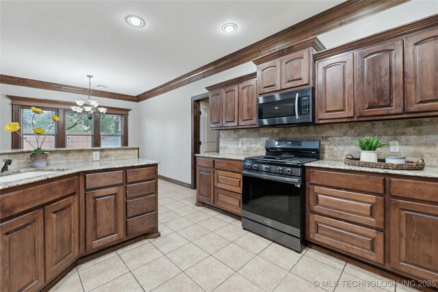 7083 E 85th St N, Owasso, OK 74055 - kitchen featuring stainless steel appliances, backsplash, a chandelier, ornamental molding, and light tile patterned flooring