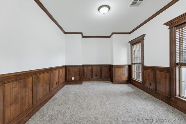 7083 E 85th St N, Owasso, OK 74055 - unfurnished room featuring wainscoting, light carpet, and crown molding