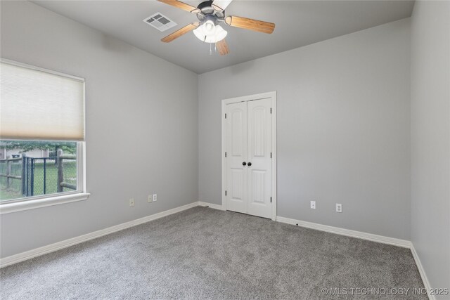 7083 E 85th St N, Owasso, OK 74055 - empty room with carpet flooring, a ceiling fan, and baseboards
