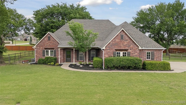 7083 E 85th St N, Owasso, OK 74055 - view of front of property featuring brick siding and roof with shingles