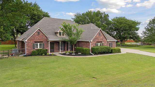 7083 E 85th St N, Owasso, OK 74055 - view of front of house with brick siding and roof with shingles