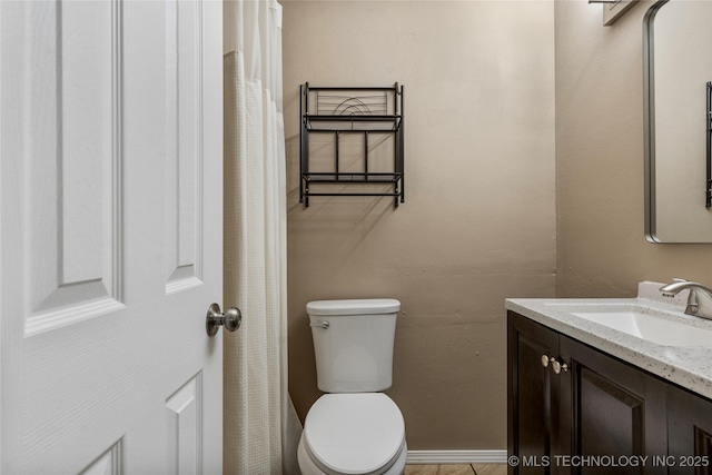 full bathroom with toilet and vanity
