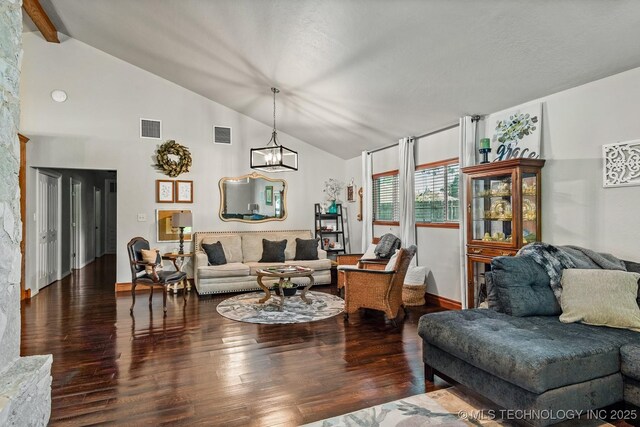 1300 S Mississippi, Ada, OK 74820 - living room featuring a chandelier, wood finished floors, beam ceiling, high vaulted ceiling, and baseboards