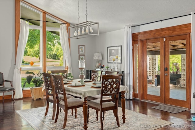 1300 S Mississippi, Ada, OK 74820 - dining room with wood finished floors, a textured ceiling, and french doors