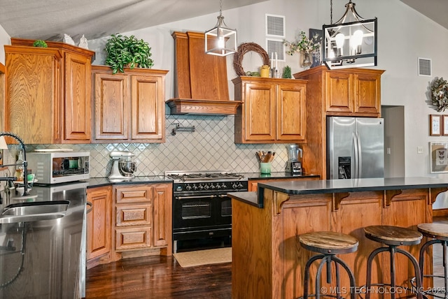 1300 S Mississippi, Ada, OK 74820 - kitchen featuring stainless steel fridge with ice dispenser, double oven range, lofted ceiling, custom exhaust hood, and dark wood finished floors