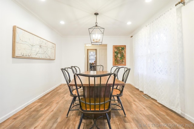 5529 S New Haven Ave, Tulsa, OK 74135 - dining space with ornamental molding, light wood finished floors, recessed lighting, baseboards, and a chandelier