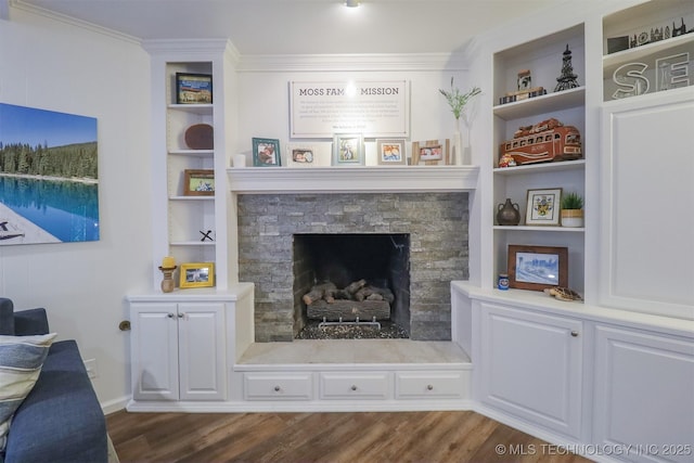 5529 S New Haven Ave, Tulsa, OK 74135 - detailed view of wood finished floors, built in shelves, a stone fireplace, and ornamental molding