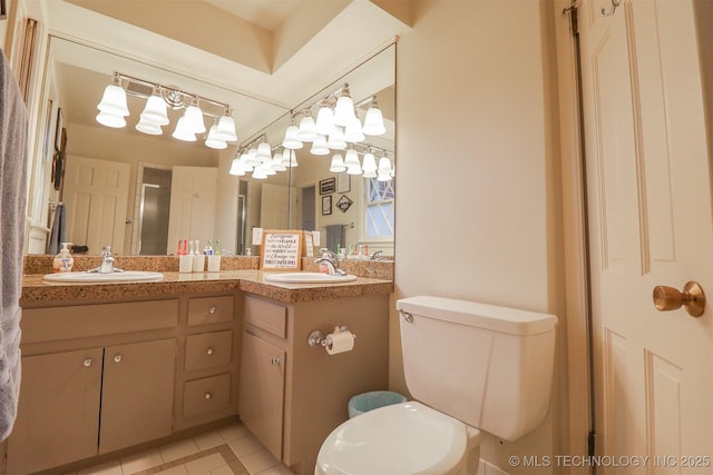5529 S New Haven Ave, Tulsa, OK 74135 - full bath with double vanity, toilet, tile patterned floors, and an enclosed shower