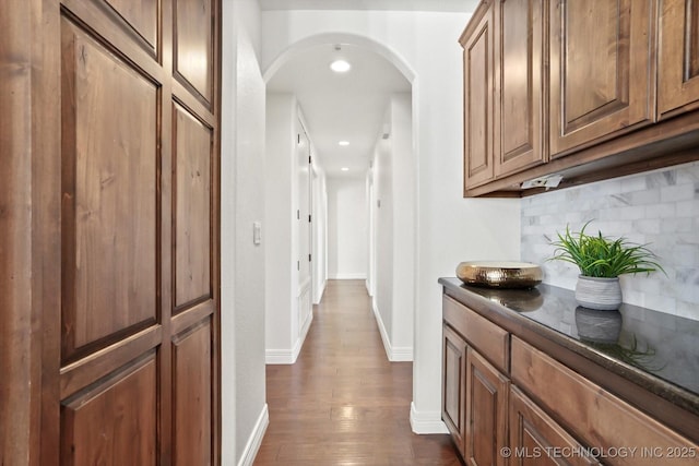15209 S 89th W Ave, Sapulpa, OK 74066 - hallway with arched walkways, dark wood finished floors, recessed lighting, and baseboards