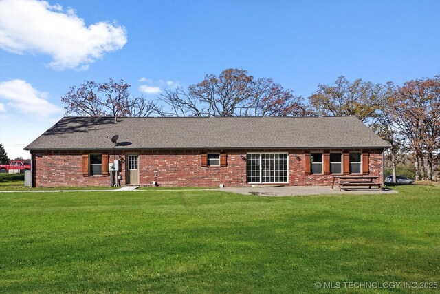 15209 S 89th W Ave, Sapulpa, OK 74066 - back of property featuring a patio, brick siding, a yard, and a shingled roof