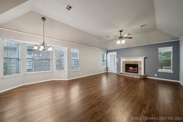 408 S Tamarack Ave, Broken Arrow, OK 74012 - unfurnished living room featuring vaulted ceiling, ceiling fan, a chandelier, a brick fireplace, and dark wood-style flooring