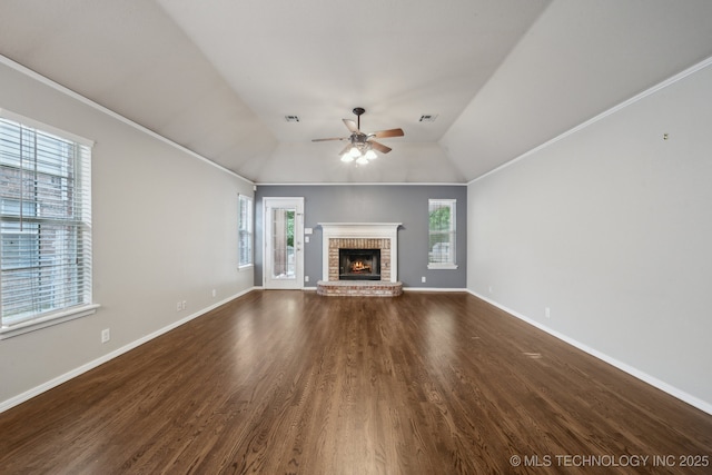 408 S Tamarack Ave, Broken Arrow, OK 74012 - unfurnished living room with a ceiling fan, plenty of natural light, dark wood finished floors, a fireplace, and crown molding