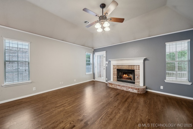 408 S Tamarack Ave, Broken Arrow, OK 74012 - unfurnished living room with ceiling fan, vaulted ceiling, wood finished floors, plenty of natural light, and a brick fireplace