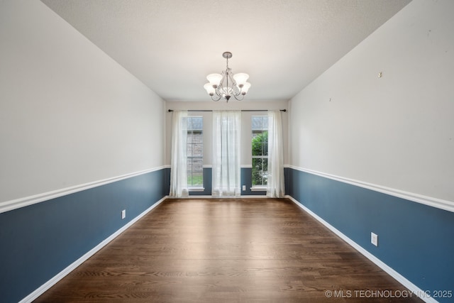 408 S Tamarack Ave, Broken Arrow, OK 74012 - empty room featuring a chandelier and wood finished floors