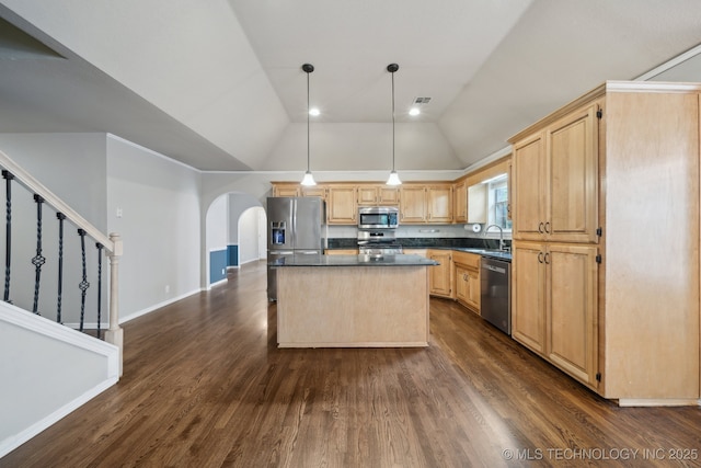 408 S Tamarack Ave, Broken Arrow, OK 74012 - kitchen with appliances with stainless steel finishes, light brown cabinets, dark countertops, arched walkways, and a center island