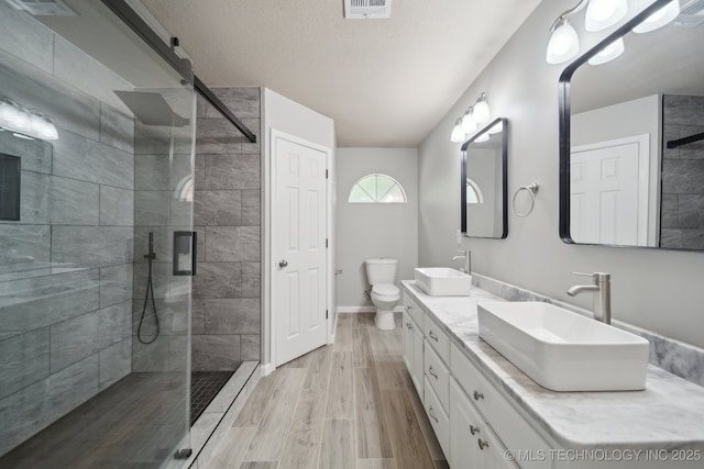 408 S Tamarack Ave, Broken Arrow, OK 74012 - full bath with double vanity, walk in shower, and wood finished floors