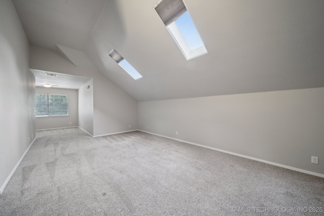 408 S Tamarack Ave, Broken Arrow, OK 74012 - additional living space featuring a skylight, vaulted ceiling, and carpet floors