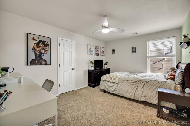 2405 S 13th St, Broken Arrow, OK 74012 - bedroom with light colored carpet and a ceiling fan