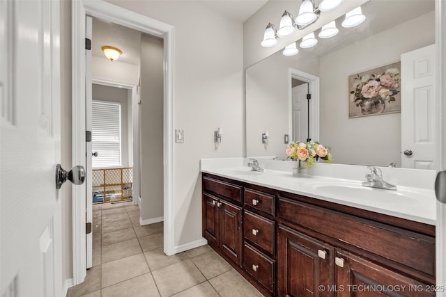 2405 S 13th St, Broken Arrow, OK 74012 - bathroom featuring tile patterned flooring, double vanity, and baseboards