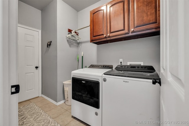 2405 S 13th St, Broken Arrow, OK 74012 - laundry area featuring washer and dryer, cabinet space, light tile patterned flooring, and baseboards