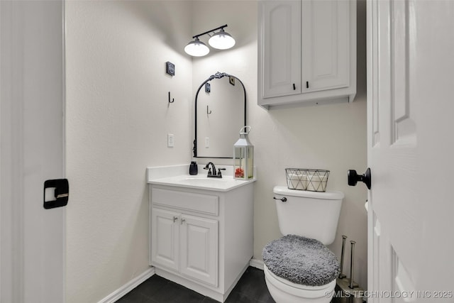 2405 S 13th St, Broken Arrow, OK 74012 - bathroom featuring vanity, toilet, and baseboards