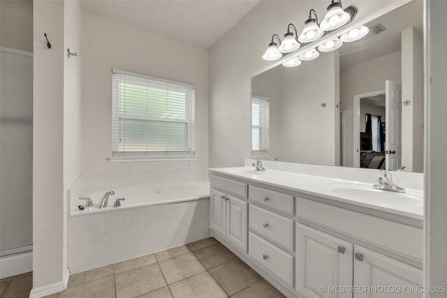 2405 S 13th St, Broken Arrow, OK 74012 - bathroom with double vanity, ensuite bathroom, a bath, and tile patterned flooring