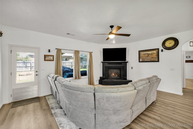 2405 S 13th St, Broken Arrow, OK 74012 - living area with ceiling fan, light wood-style floors, a fireplace, and baseboards