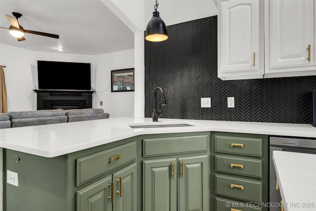 2405 S 13th St, Broken Arrow, OK 74012 - kitchen featuring green cabinetry, a sink, open floor plan, white cabinetry, and ceiling fan