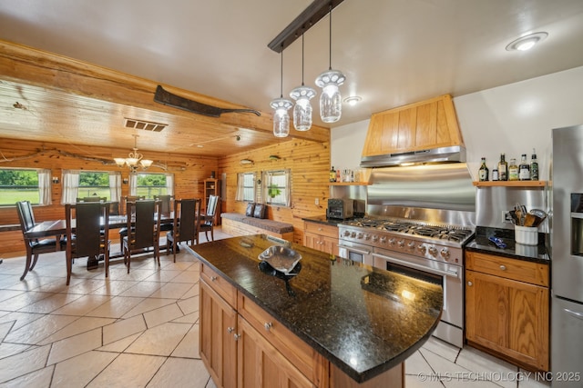 36105 S 4202nd Rd, Inola, OK 74036 - kitchen with appliances with stainless steel finishes, wooden walls, custom range hood, a chandelier, and decorative light fixtures