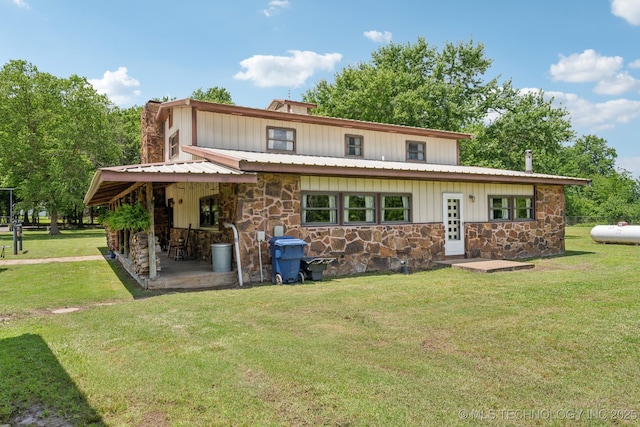 36105 S 4202nd Rd, Inola, OK 74036 - view of front of property featuring stone siding, a front lawn, and board and batten siding