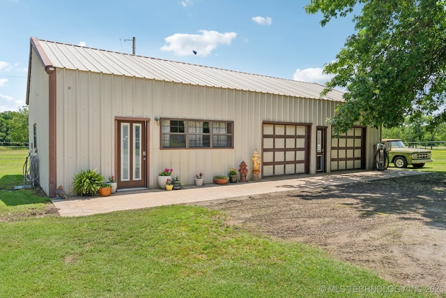 36105 S 4202nd Rd, Inola, OK 74036 - view of front of home with dirt driveway, metal roof, and a garage