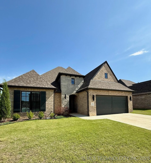 14503 E 80th St N, Owasso, OK 74055 - french provincial home with a garage, a front yard, driveway, and roof with shingles