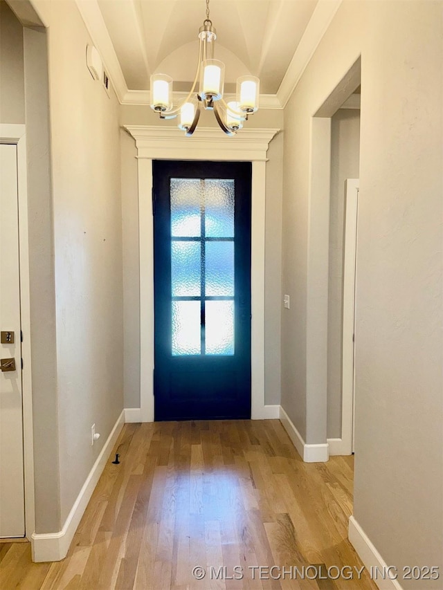 14503 E 80th St N, Owasso, OK 74055 - entrance foyer with a chandelier, light wood-style flooring, ornamental molding, baseboards, and lofted ceiling