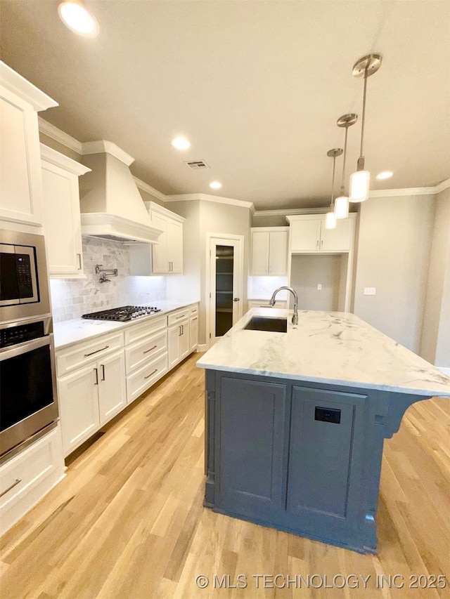 14503 E 80th St N, Owasso, OK 74055 - kitchen featuring stainless steel appliances, a sink, custom exhaust hood, crown molding, and recessed lighting