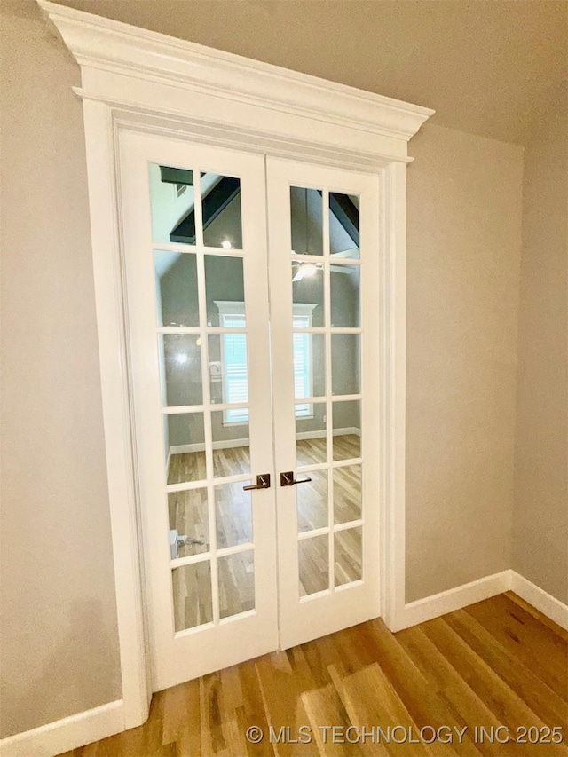 14503 E 80th St N, Owasso, OK 74055 - doorway featuring wood finished floors, french doors, baseboards, and ornamental molding